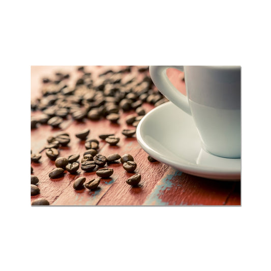 Roasted coffee beans on painted wooden board with white espresso cup and saucer Fine Art Print