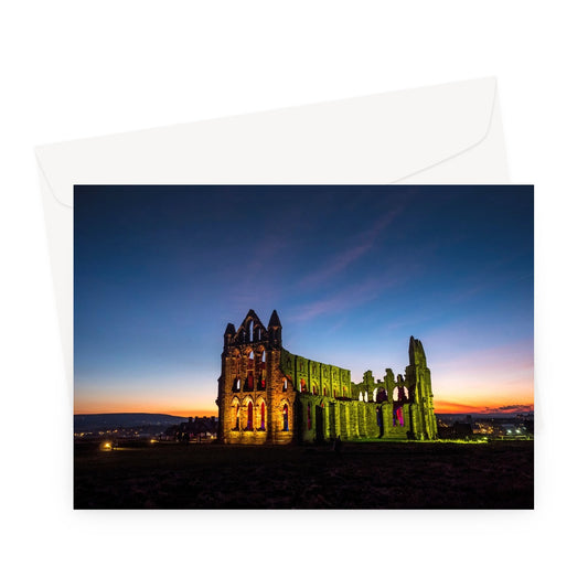 Whitby Abbey illuminated for Halloween, Whitby, UK. Greeting Card