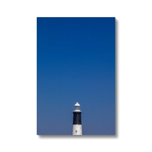 Top of a lighthouse against blue sky Canvas