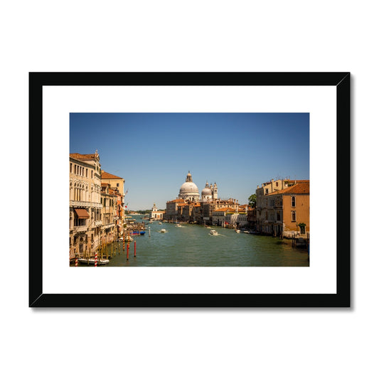 Grand canal in Venice with the domes of the church Santa Maria della  Salute in the distance Framed & Mounted Print