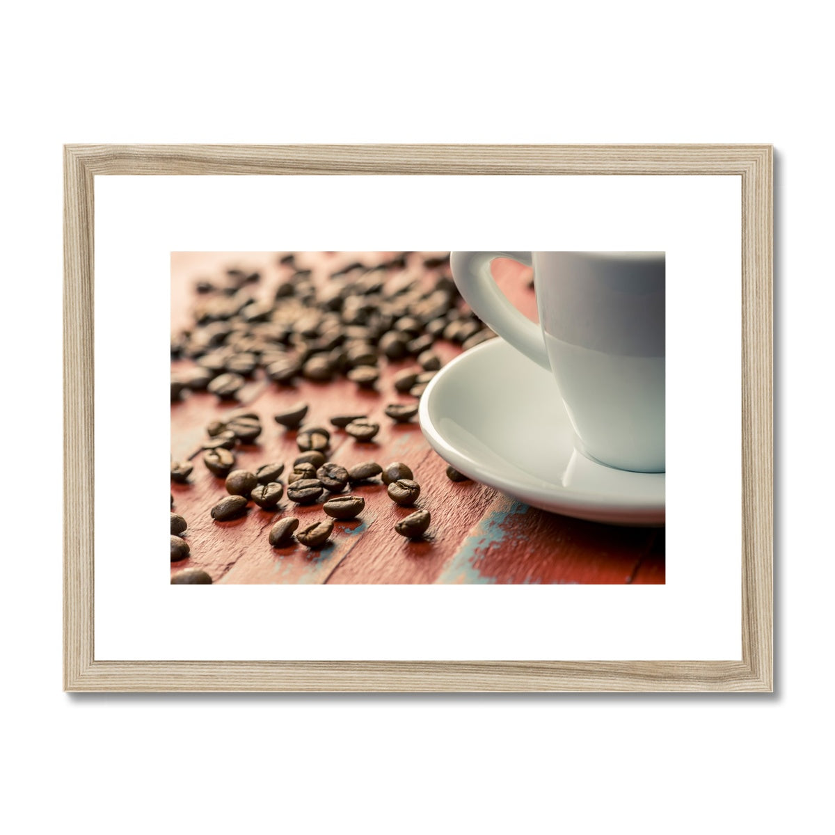 Roasted coffee beans on painted wooden board with white espresso cup and saucer Framed & Mounted Print