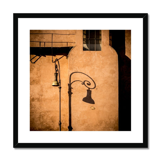 Street lamp and shadow on rendered building wall, Rome, Italy. Framed & Mounted Print