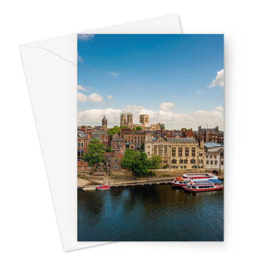Moored boats on the River Ouse with the Guildhall and York Minster in the distance. York. UK Greeting Card