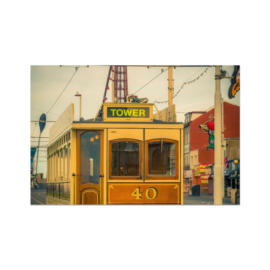 Traditional tram running along seafront promenade with Blackpool Tower in background - Blackpool,UK. Fine Art Print