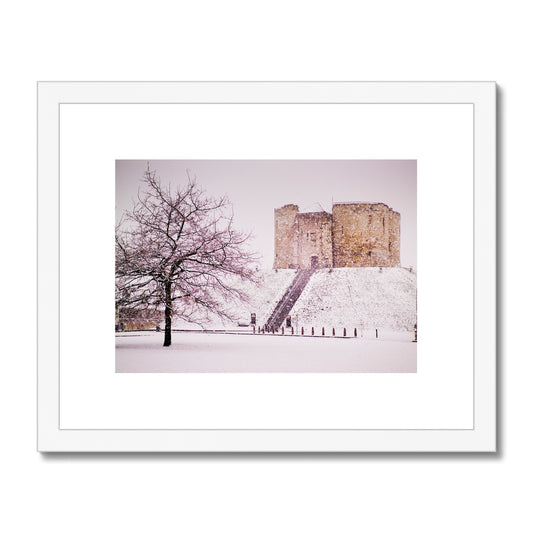 Clifford's Tower in snow blizzard, York, UK Framed & Mounted Print
