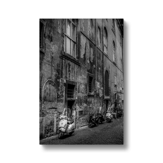 Typical street with parked scooters in the centre of Rome. Italy. Canvas