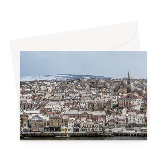 View of Whitby town centre in snow from St Mary's Church, Whitby, UK. Greeting Card