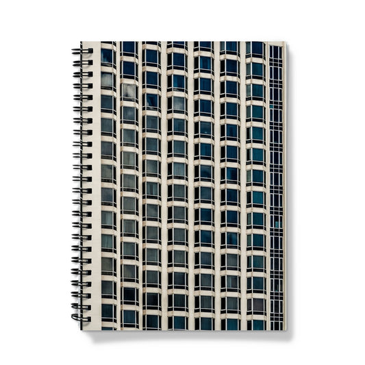 Symmetrical pattern of windows on contemporary skyscraper Notebook