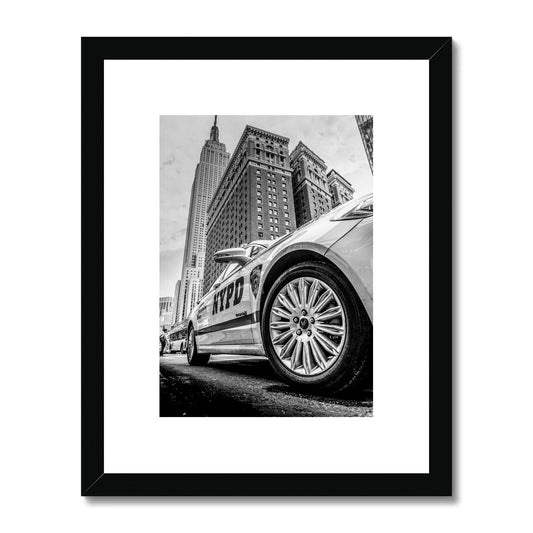 NYPD patrol car with Empire State Building on W 34th St, New York City, USA. Framed & Mounted Print