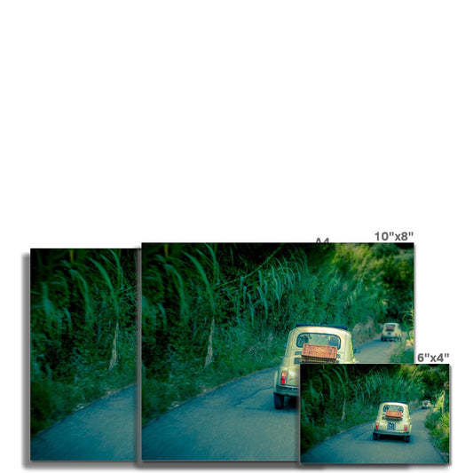Classic Fiat 500 cars driving on a road in Florence, Italy.  Fine Art Print