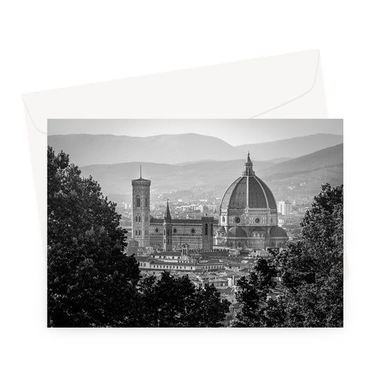 The south façade of Florence Cathedral glimpsed through the trees of San Miniato al Monte. Italy.  Greeting Card