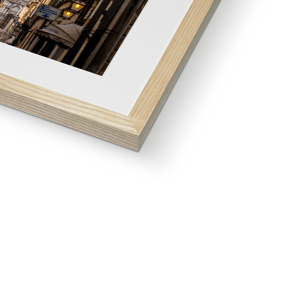 Giotto's Campanile glimpsed between buildings in the city of Florence, Italy. Framed & Mounted Print