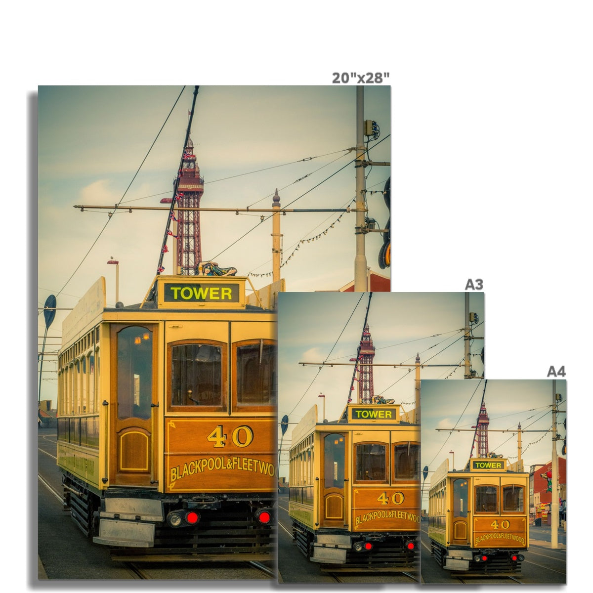 Traditional tram running along seafront promenade with Blackpool Tower in background - Blackpool,UK. Fine Art Print
