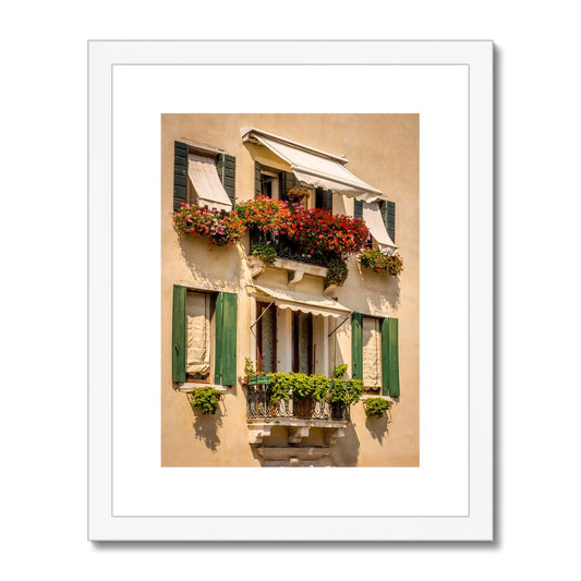 Traditional canal-side cream-rendered house with shuttered windows and window boxes. Venice. Italy. Framed & Mounted Print