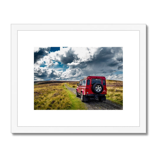 Red Land Rover Defender 110 4WD car navigating a Green Lane track, North Yorkshire Moors, UK. Framed & Mounted Print