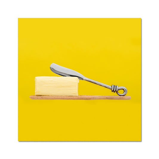 Homemade butter on wooden paddle with butter knife and yellow background. Fine Art Print
