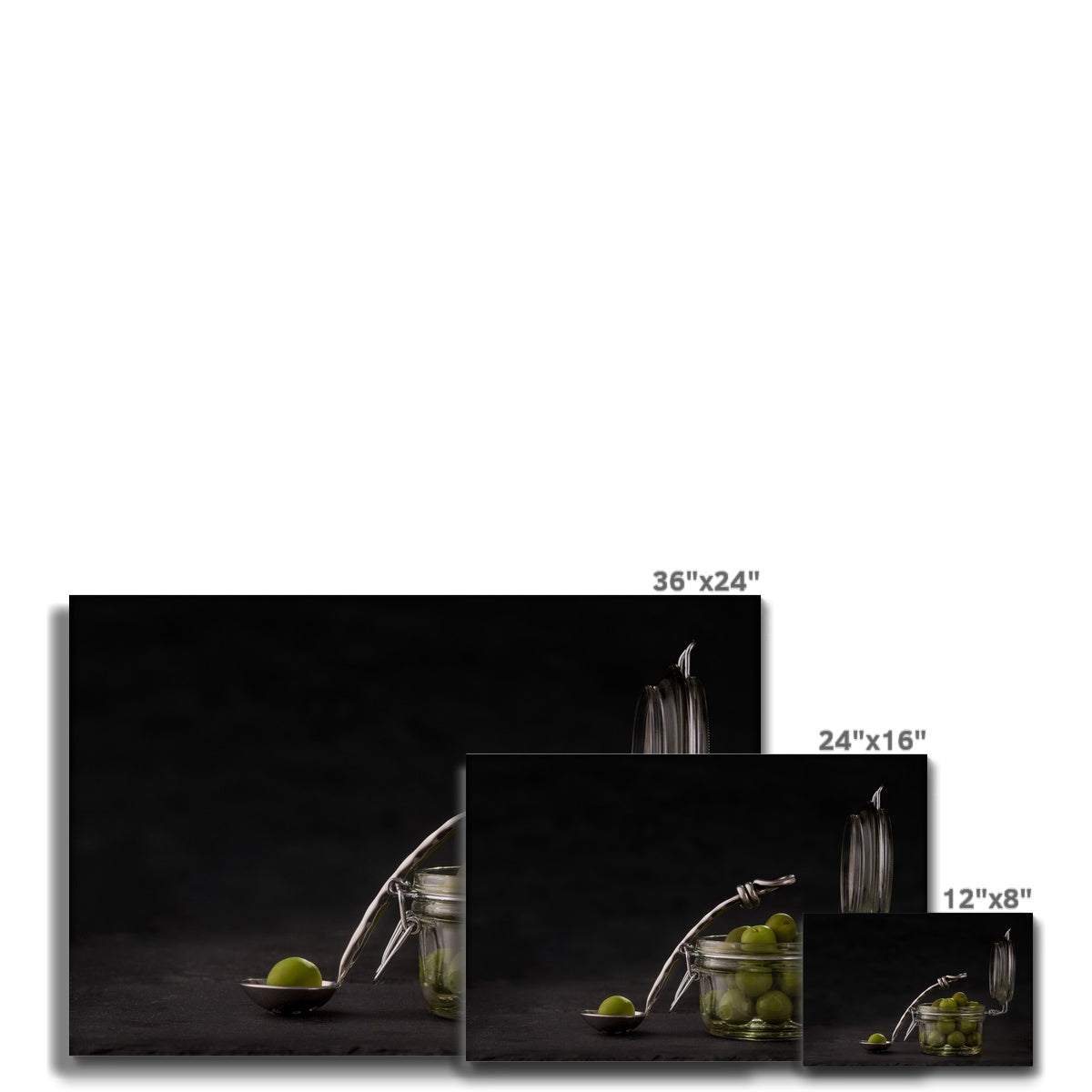 Jar of green olives with single olive on spoon against grey slate background. Canvas