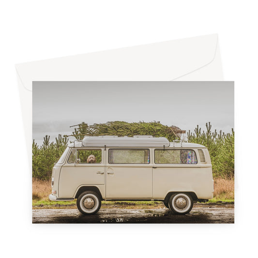 1972 VW Bay Window Campervan parked with with Christmas tree on roof and Cockapoo dog looking out of window. Greeting Card