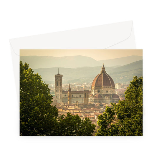 The south façade of Florence Cathedral glimpsed through the trees of San Miniato al Monte.  Italy. Greeting Card