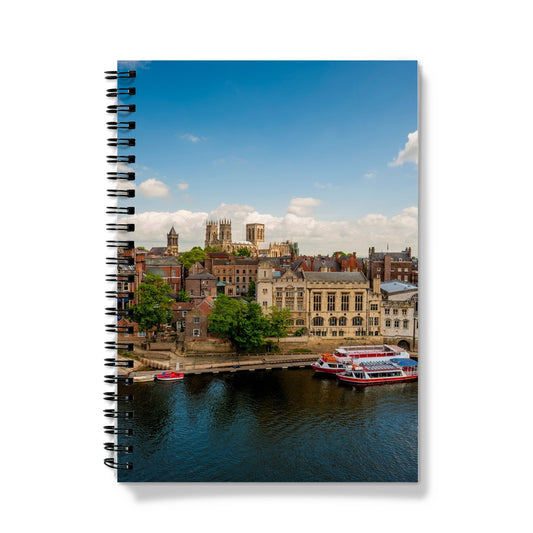 Moored boats on the River Ouse with the Guildhall and York Minster in the distance. York. UK Notebook