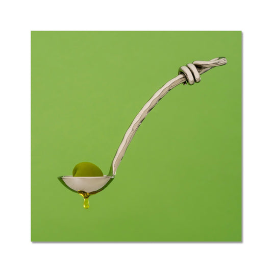 Single green olive on spoon with oil dripping. Fine Art Print
