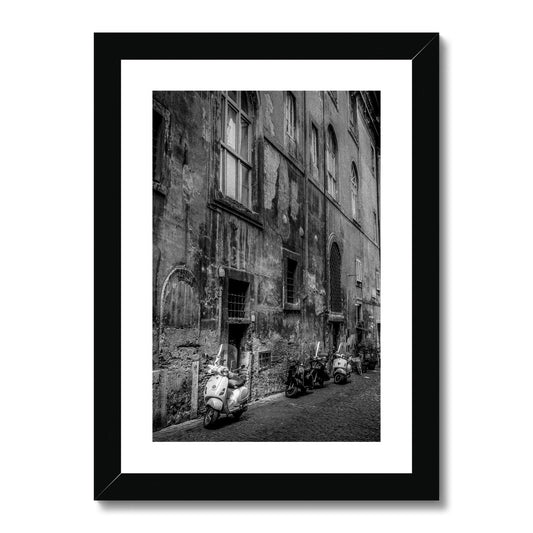 Typical street with parked scooters in the centre of Rome. Italy. Framed & Mounted Print