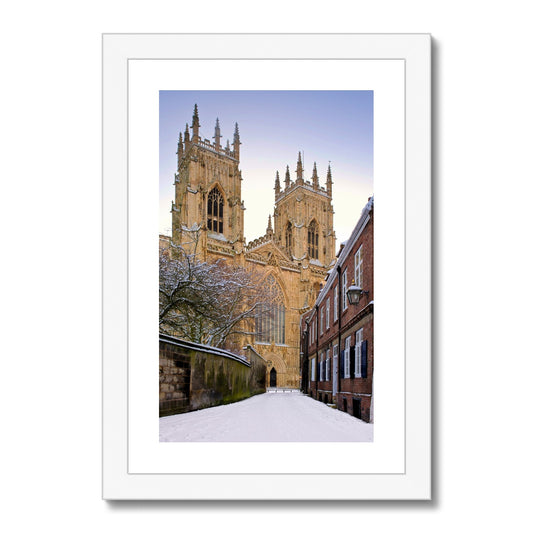 York Minster in the snow seen from Precentors Court. York, UK. Framed & Mounted Print