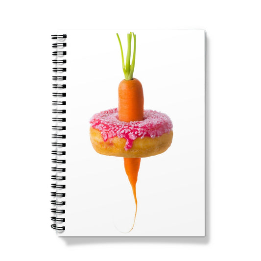 Carrot through a doughnut demonstrating healthy versus unhealthy food choices.  Notebook