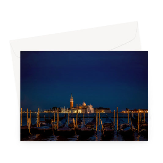 Gondolas moored in St Mark's Basin with San Giorgio Maggiore in the background at night, Venice, Italy. Greeting Card