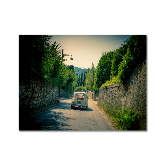 Classic Fiat 500 car driving on a road in Florence, Italy. Fine Art Print