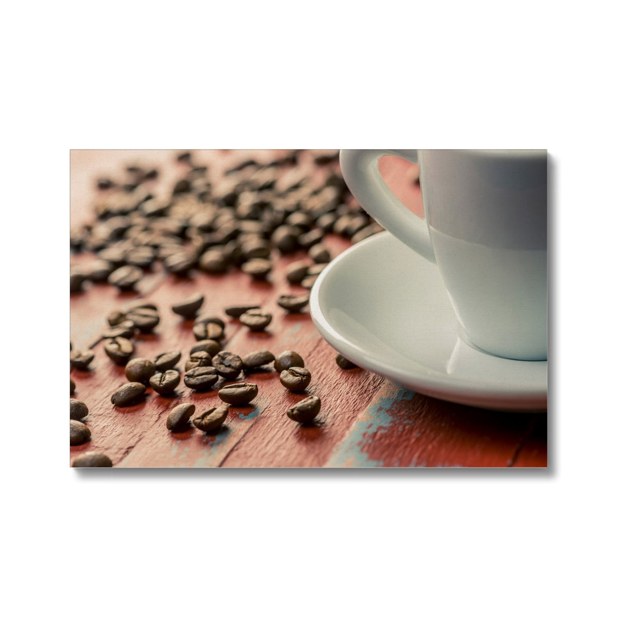 Roasted coffee beans on painted wooden board with white espresso cup and saucer Canvas