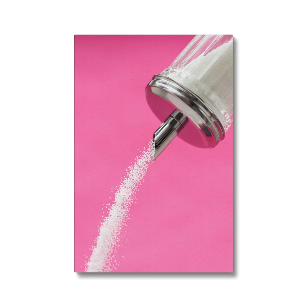 Sugar dispenser pouring against pink background Canvas