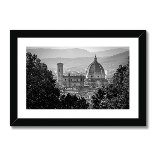 The south façade of Florence Cathedral glimpsed through the trees of San Miniato al Monte. Italy.  Framed & Mounted Print