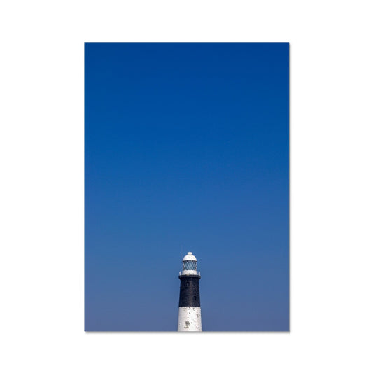 Top of a lighthouse against blue sky Fine Art Print