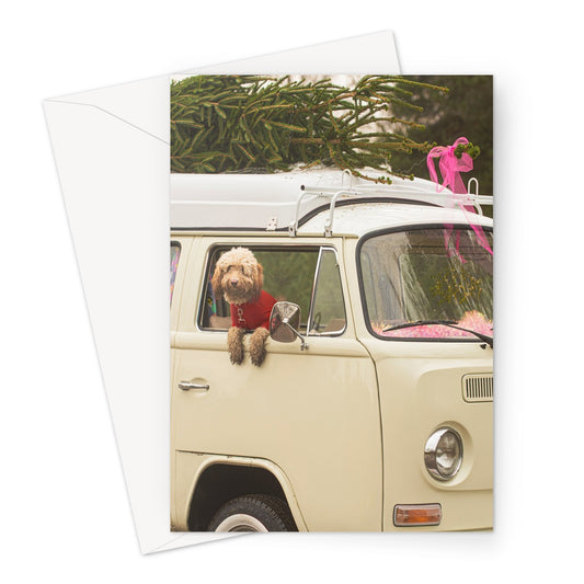 1972 VW Bay Window Campervan parked with with Christmas tree on roof and Cockapoo dog looking out of window. Greeting Card