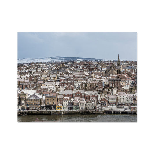 View of Whitby town centre in snow from St Mary's Church, Whitby, UK. Fine Art Print