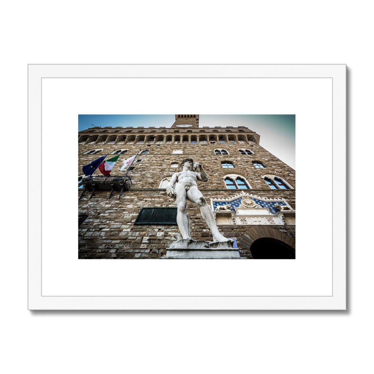 Statue of David overlooking Piazza della Signoria, with Palazzo Vecchio behind. Florence, Italy. Framed & Mounted Print