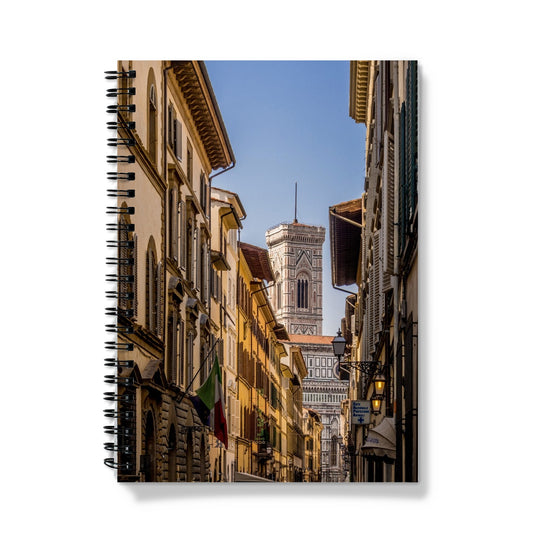 Giotto's Campanile glimpsed between buildings in the city of Florence, Italy. Notebook