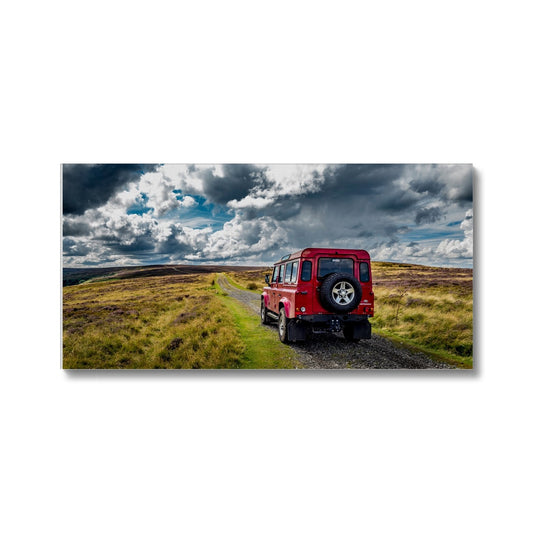 Red Land Rover Defender 110 4WD car navigating a Green Lane track, North Yorkshire Moors, UK. Canvas