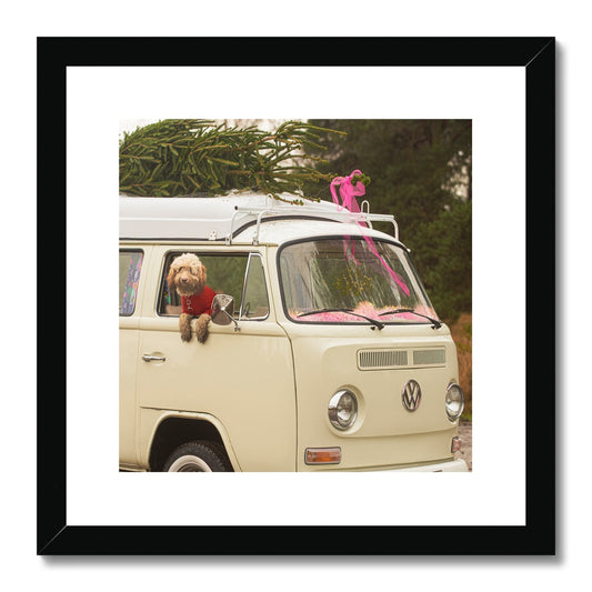 1972 VW Bay Window Campervan parked with with Christmas tree on roof and Cockapoo dog looking out of window. Framed & Mounted Print