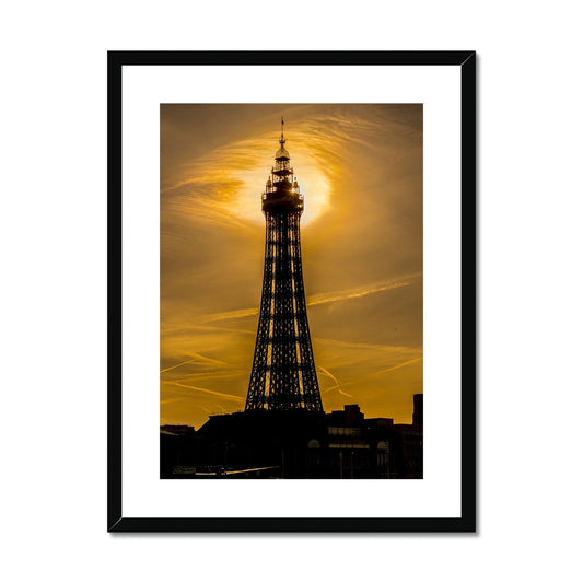 Blackpool Tower silhouetted against morning sunlight. UK. Framed & Mounted Print