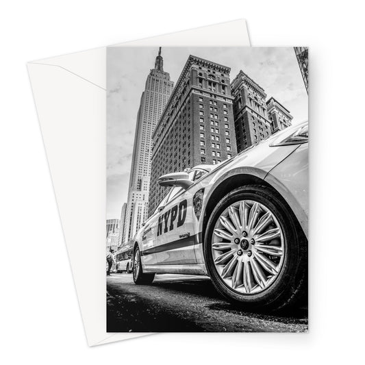 NYPD patrol car with Empire State Building on W 34th St, New York City, USA. Greeting Card