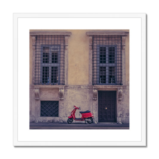 Red scooter parked outside a building in Rome, Italy. Framed & Mounted Print